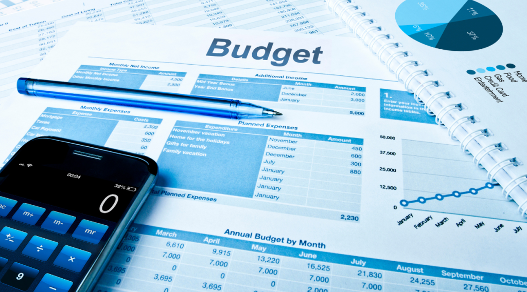lead generation cost business owner analyzing marketing budget spreadsheets