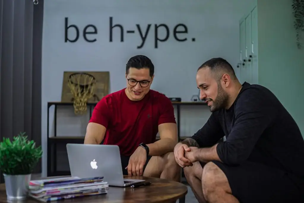 wordpress web designer reviewing client feedback on laptop